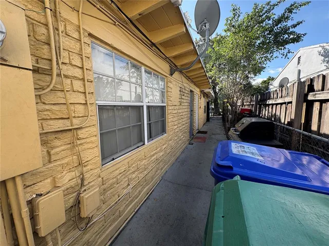 a bathroom with a toilet and a shower curtain