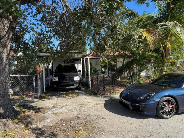 a view of a car parked in front of a house
