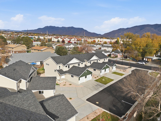 1615 North Angel Street, Unit E Layton, UT 84041 - Photo 36 of 42 Aerial view of residential area featuring a mountainous background