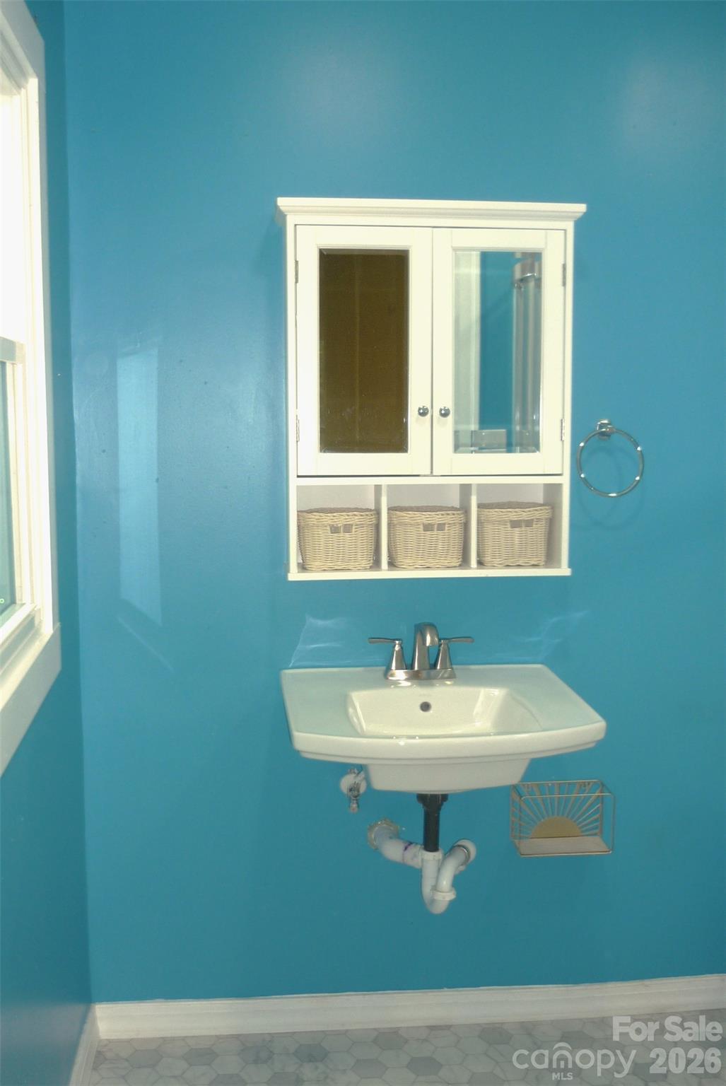 120 Bradley Road Shelby, NC 28152 - Photo 24 of 42 a bathroom with a sink a mirror and window