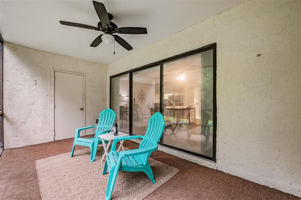1801 East Lake Road South, Unit 6D Palm Harbor, FL 34685 - Photo 22 of 24 a living room with furniture and a window