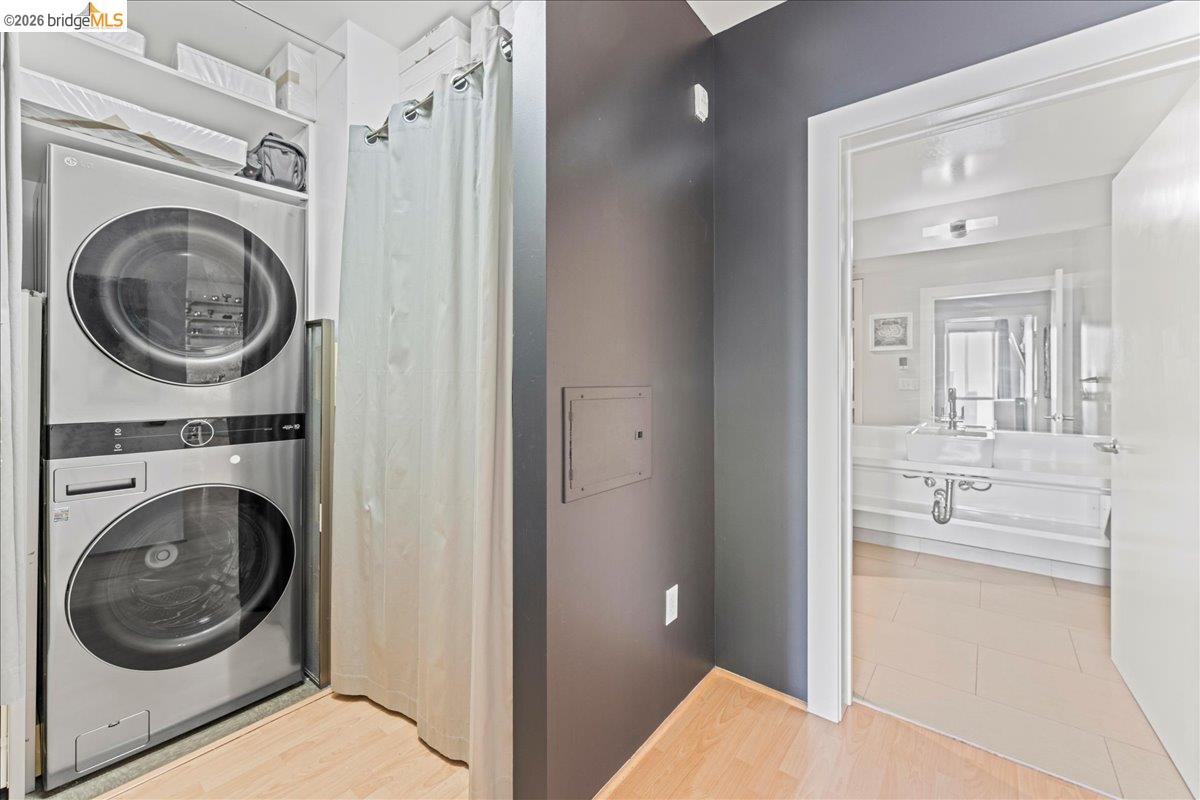 1201 Pine Street, Unit 354 Oakland, CA 94607 - Photo 13 of 26 a view of a hallway with washer and dryer