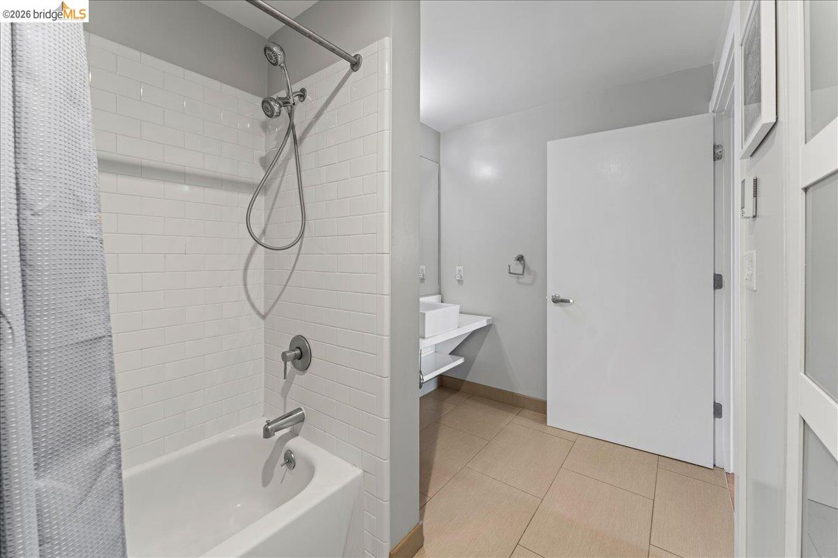 1201 Pine Street, Unit 354 Oakland, CA 94607 - Photo 8 of 26 a bathroom with a bathtub and a shower