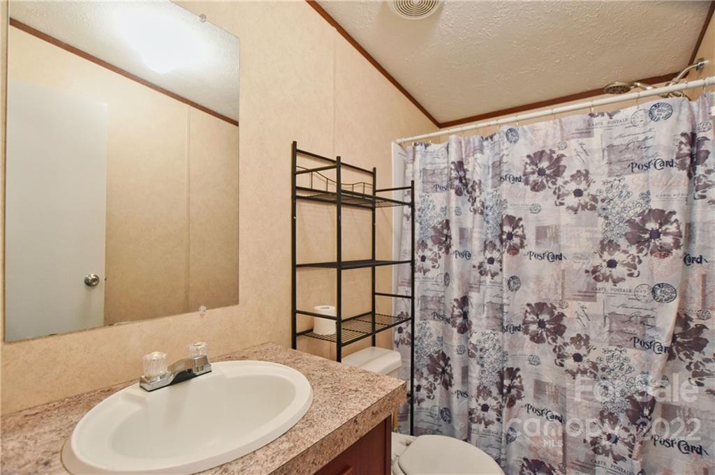 191 East Bells Branch Road Blacksburg, SC 29702 - Photo 10 of 14 a bathroom with a sink toilet and shower