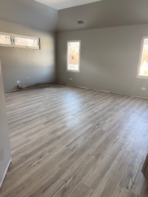 7128 Cork Avenue Justice, IL 60458 - Photo 13 of 17 an empty room with wooden floor and windows