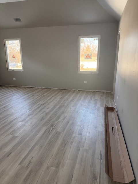 7128 Cork Avenue Justice, IL 60458 - Photo 14 of 17 an empty room with wooden floor and windows
