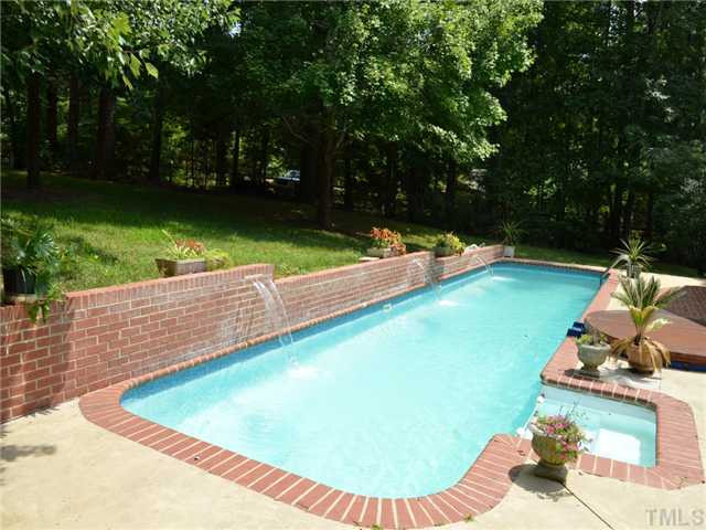5429 Earle Road Raleigh, NC 27606 - Photo 22 of 25 Heated Pool with 3 waterfalls and adjoining whirlpool/hot tub
