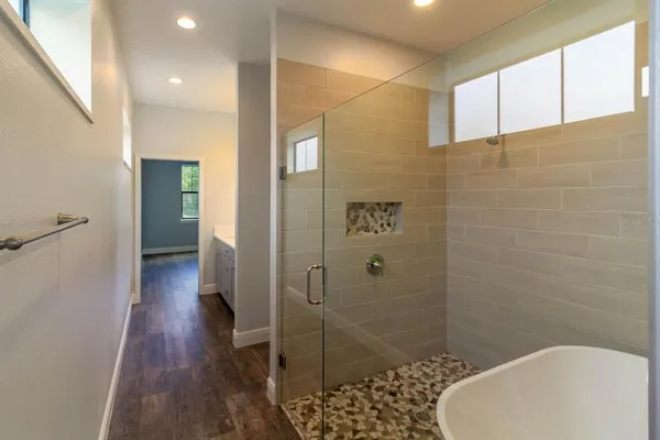 a bathroom with a bathtub and shower
