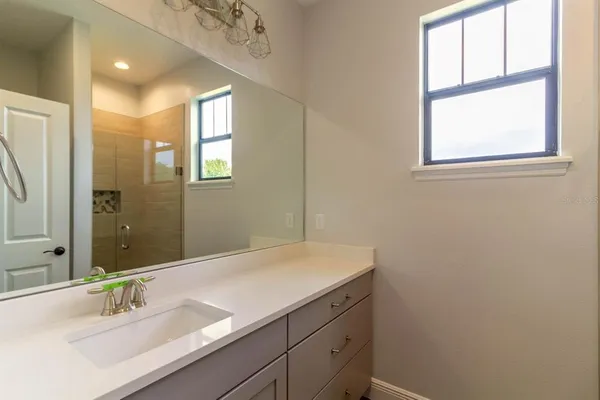 a bathroom with a sink and a mirror