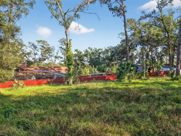 a view of a swimming pool with an outdoor space and seating area