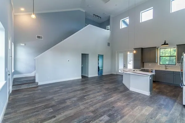 a view of a kitchen cabinets and wooden floor