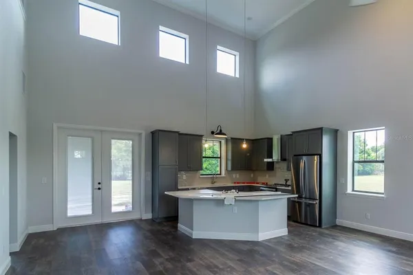 a kitchen with a refrigerator and window