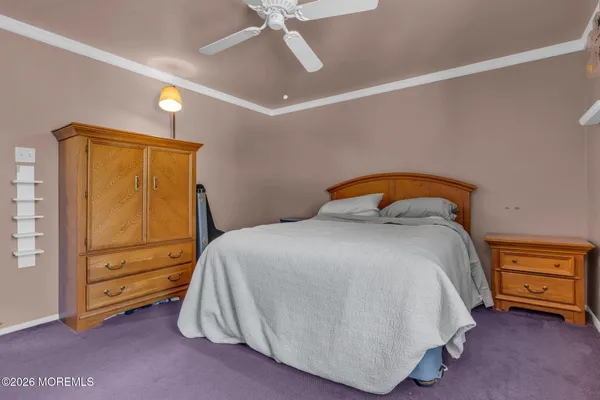 a bedroom with a bed and a cabinets