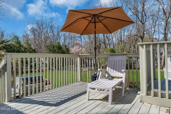 a view of a wooden deck and a patio