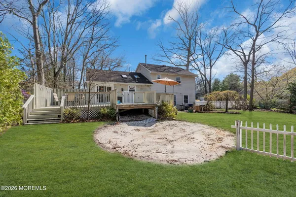 a view of a house with a back yard