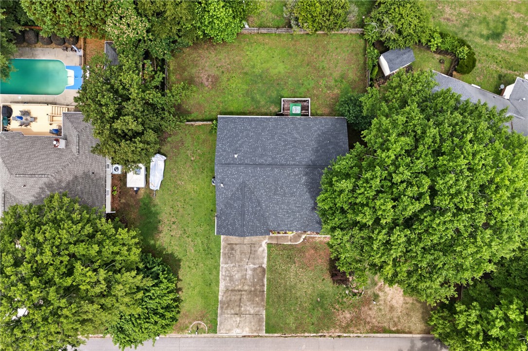 207 Hunters Lane Anderson, SC 29625 - Photo 40 of 46 An aerial perspective reveals a private pool with ample decking, set among mature trees and green spaces.