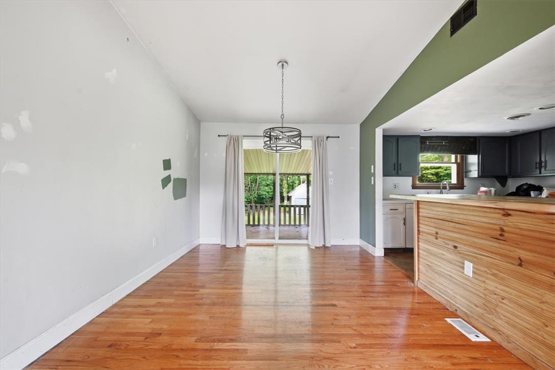 9870 North Delaware Drive Bangor, PA 18013 - Photo 21 of 62 Gleaming hardwood floors and a sliding glass door define this open dining area.