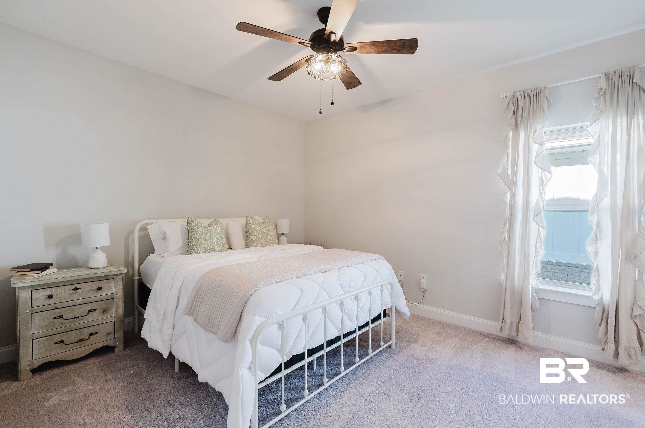 7872 Calverton Street Foley, AL 36535 - Photo 51 of 76 Carpeted room with a ceiling fan featuring wood-finish blades, a single window with white trim, and light-toned walls