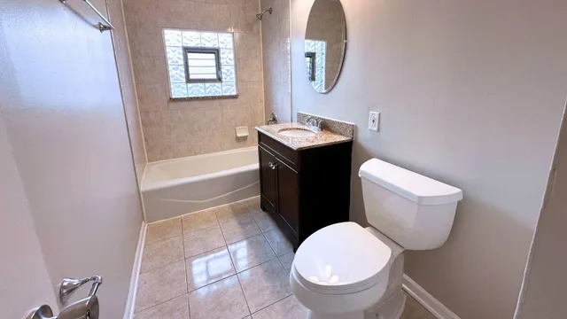 a backyard of a house with a garden and barbeque oven