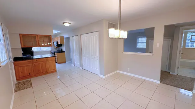 a kitchen with stainless steel appliances a refrigerator and microwave