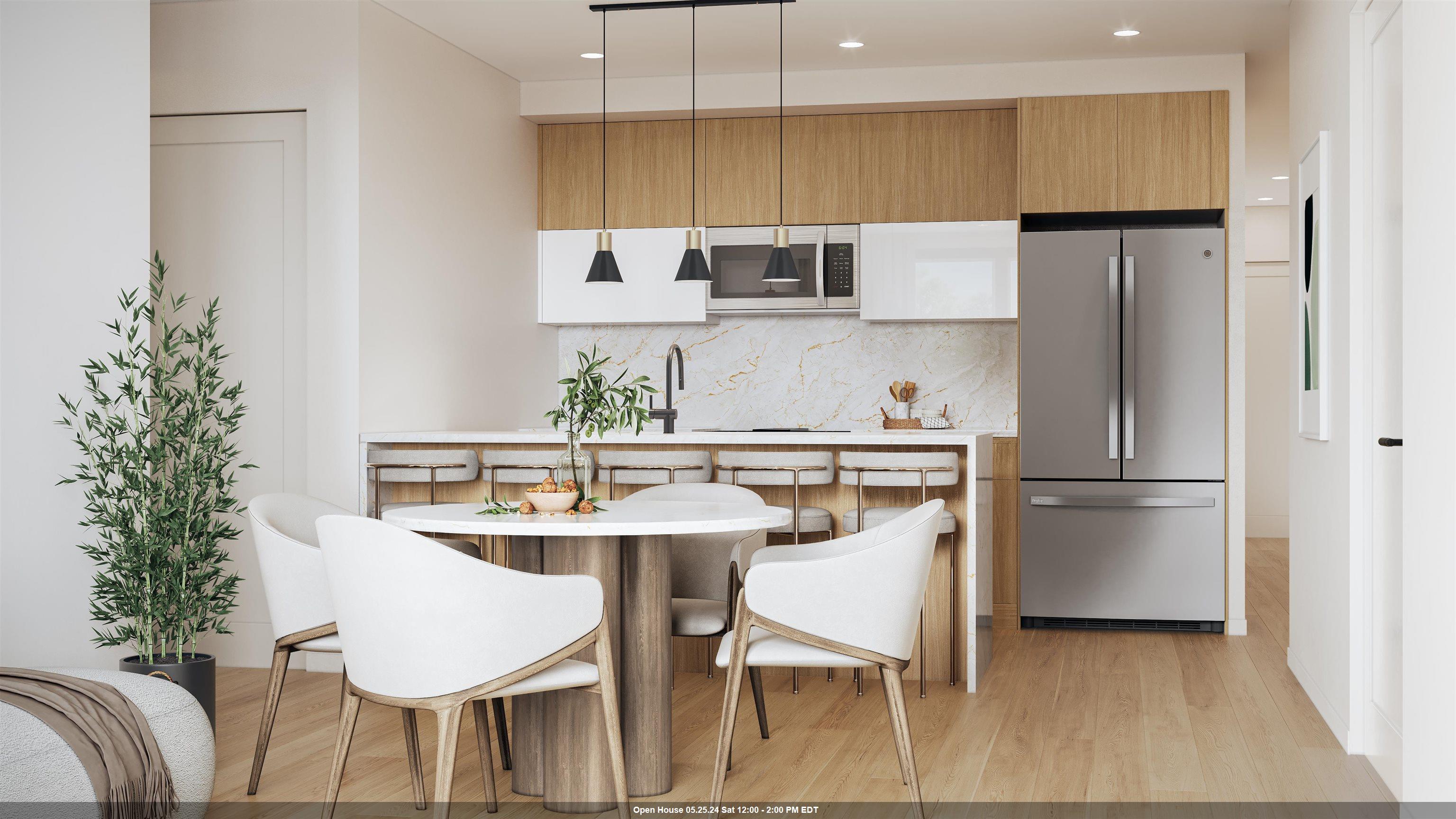 a kitchen with stainless steel appliances a dining table chairs refrigerator and sink