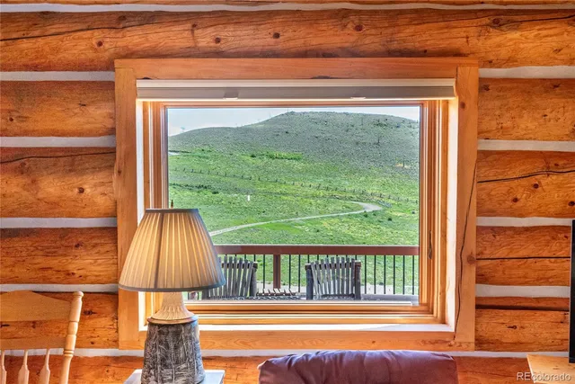 a bedroom with a bed and furniture with the outer view