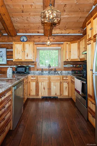 a kitchen with stainless steel appliances lots of counter top space
