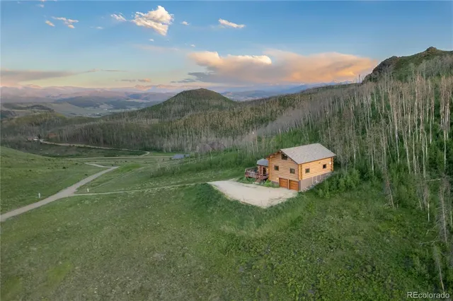 a view of a golf course with a house