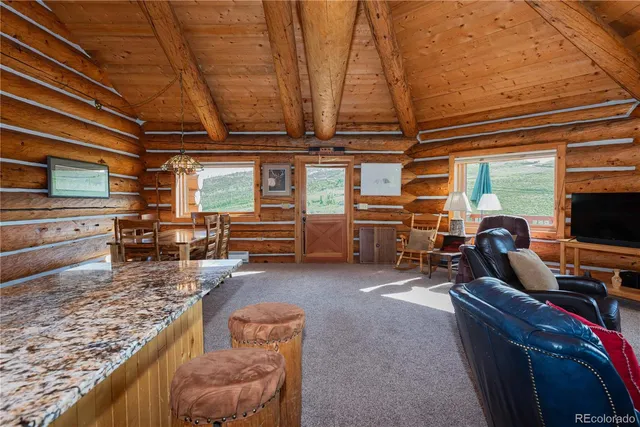 a blue couch sitting in front of a window