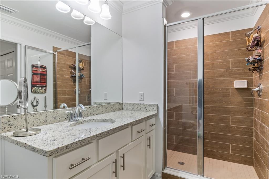 43010 Greenway Boulevard, Unit 237 Punta Gorda, FL 33982 - Photo 11 of 11 a bathroom with a shower sink and mirror