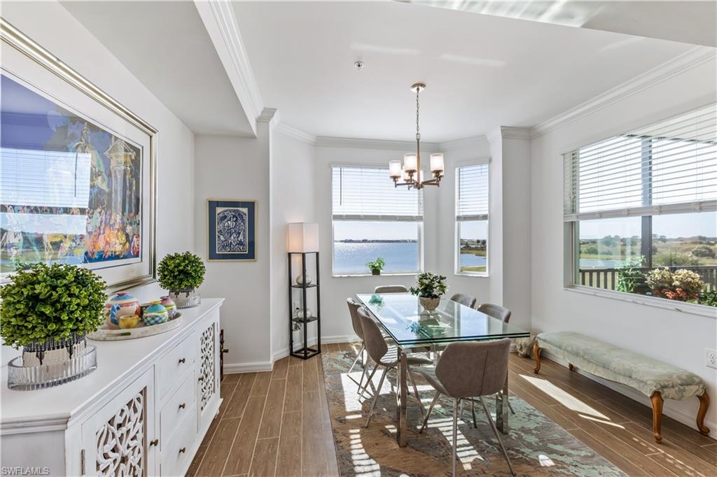 43010 Greenway Boulevard, Unit 237 Punta Gorda, FL 33982 - Photo 7 of 11 a living room with furniture and a chandelier