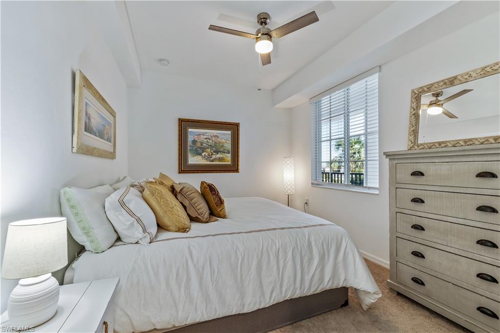 43010 Greenway Boulevard, Unit 237 Punta Gorda, FL 33982 - Photo 8 of 11 a bedroom with a bed and a dresser