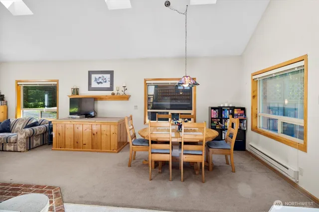 a dining room with furniture and window