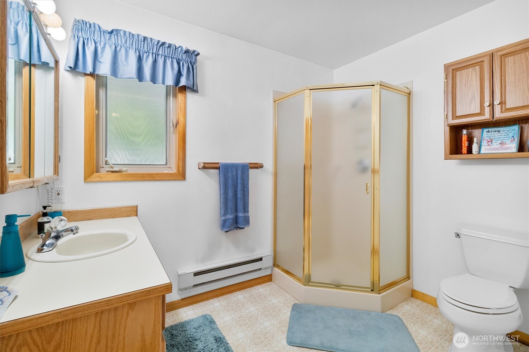 7101 Rainier Way Glacier, WA 98244 - Photo 13 of 38 a bathroom with a granite countertop sink mirror vanity and toilet