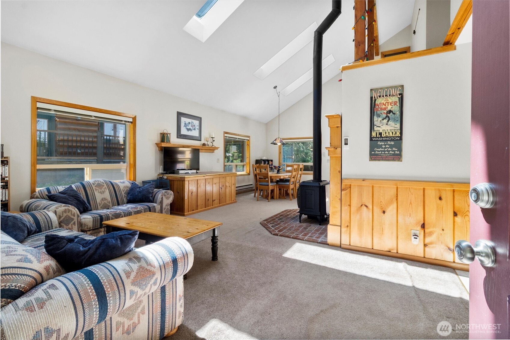 7101 Rainier Way Glacier, WA 98244 - Photo 3 of 38 a living room with furniture large window and a flat screen tv