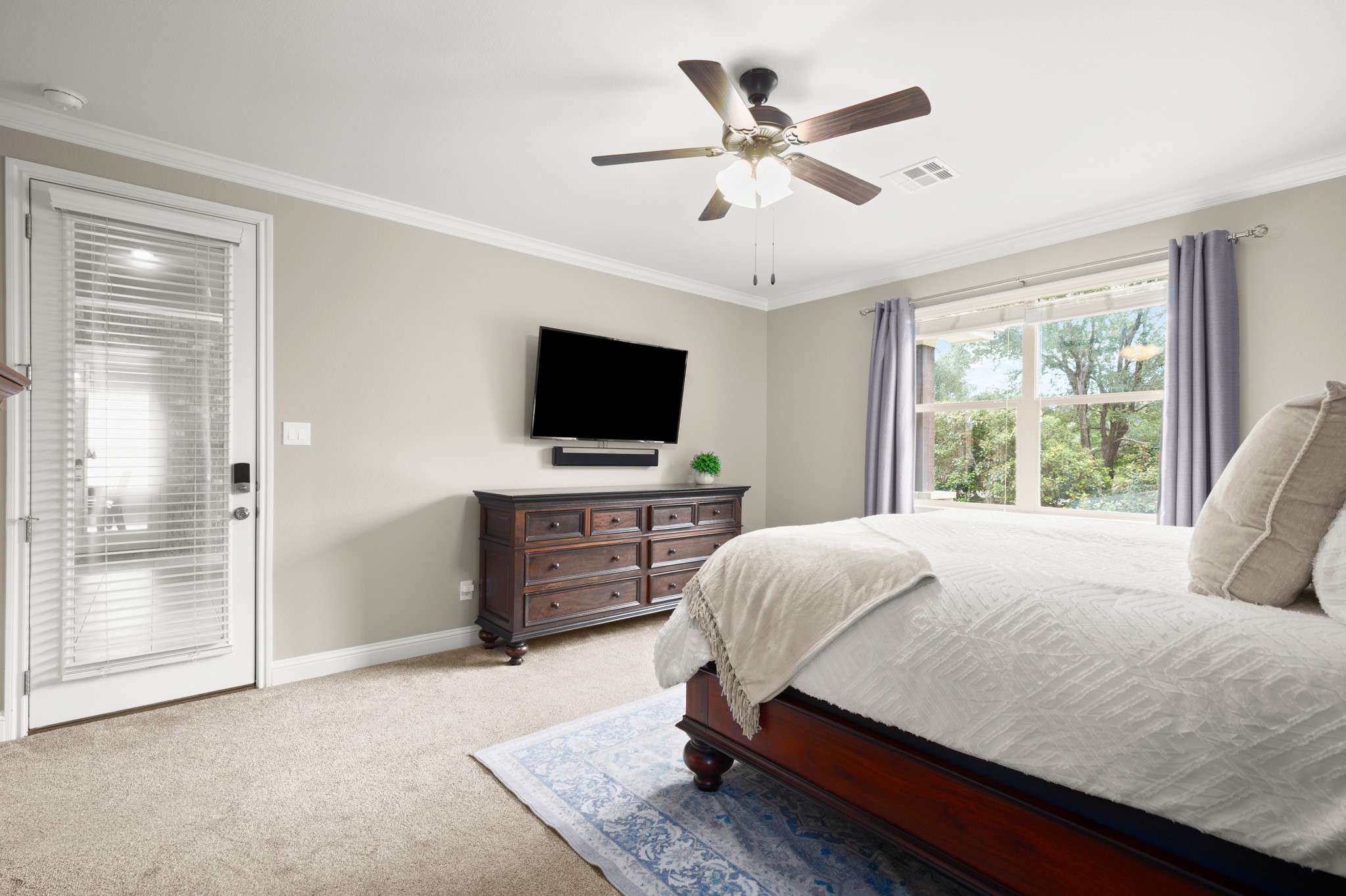 502 Spring Arbor Lane Cedar Park, TX 78613 - Photo 20 of 40 The spacious primary suite offers walkout access to the entertainer's porch and comes with a private ensuite bath.