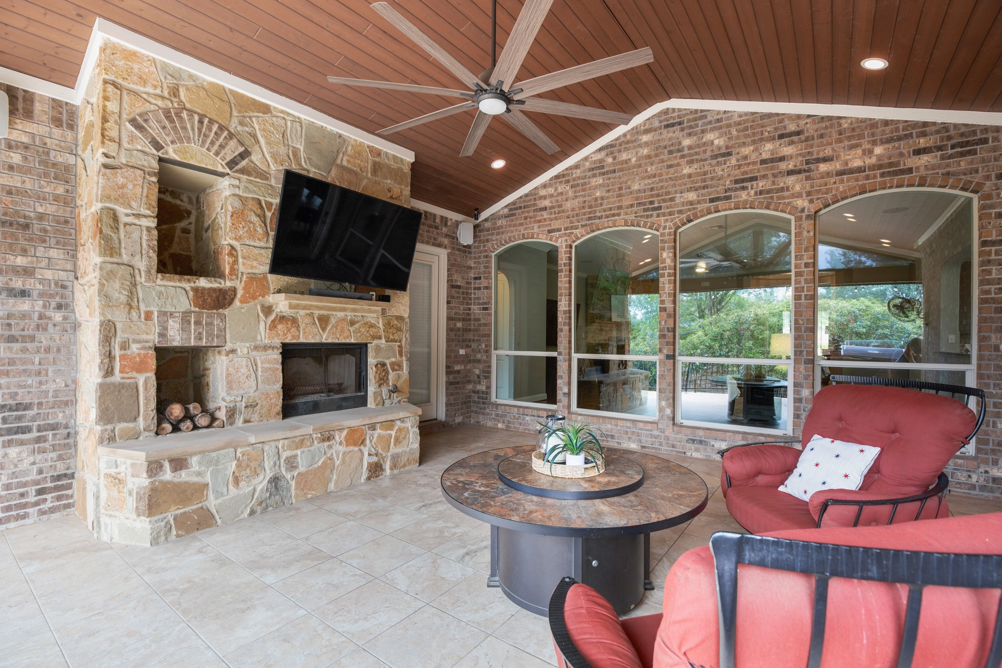 502 Spring Arbor Lane Cedar Park, TX 78613 - Photo 31 of 40 Amazing covered porch with a wood-burning fireplace, TV mount, and surround sound for comfortable outdoor living year-round.