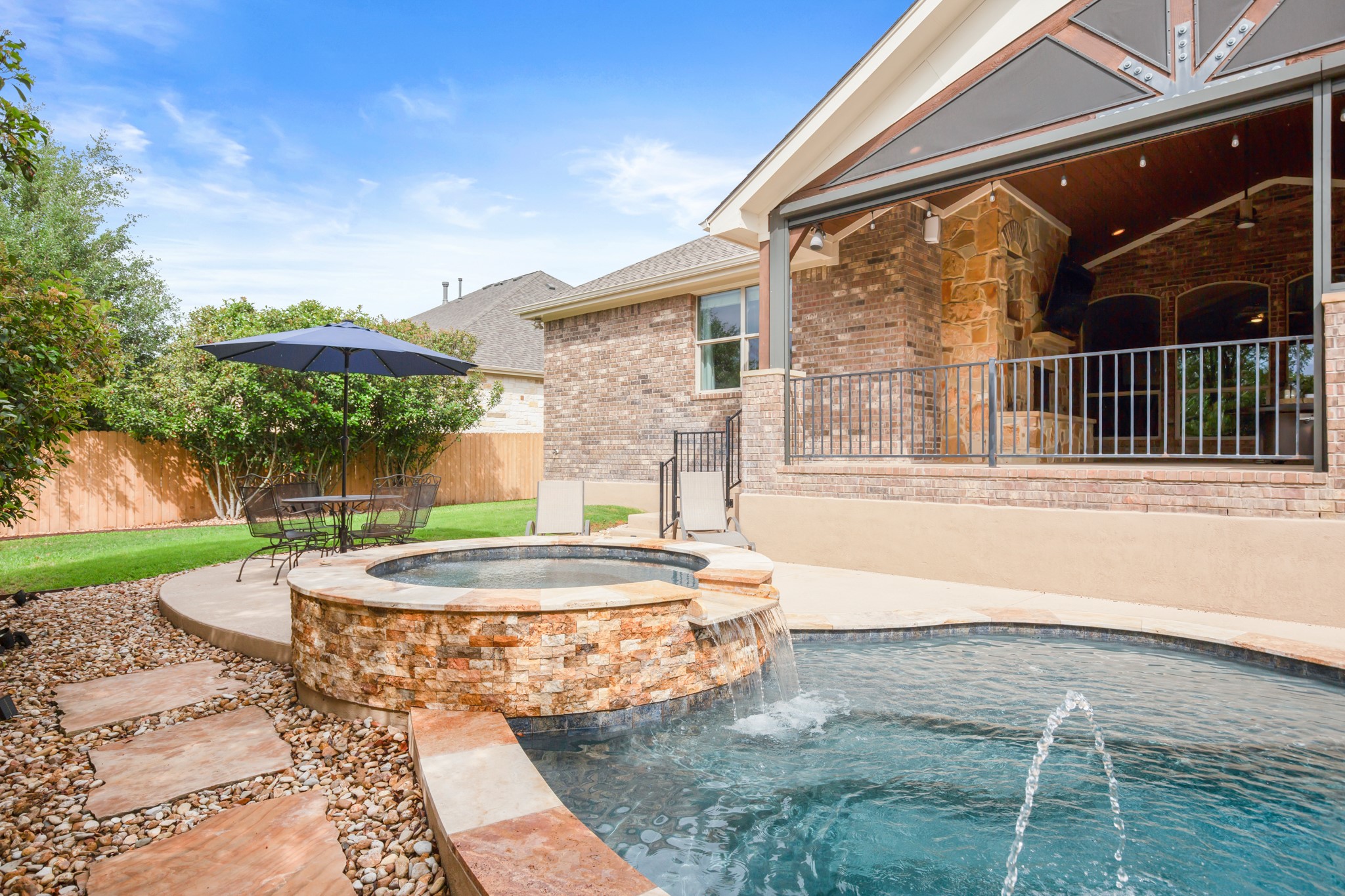 502 Spring Arbor Lane Cedar Park, TX 78613 - Photo 33 of 40 The private backyard feels like a personal retreat, centered around a resort-style pool and spa added in 2016.
