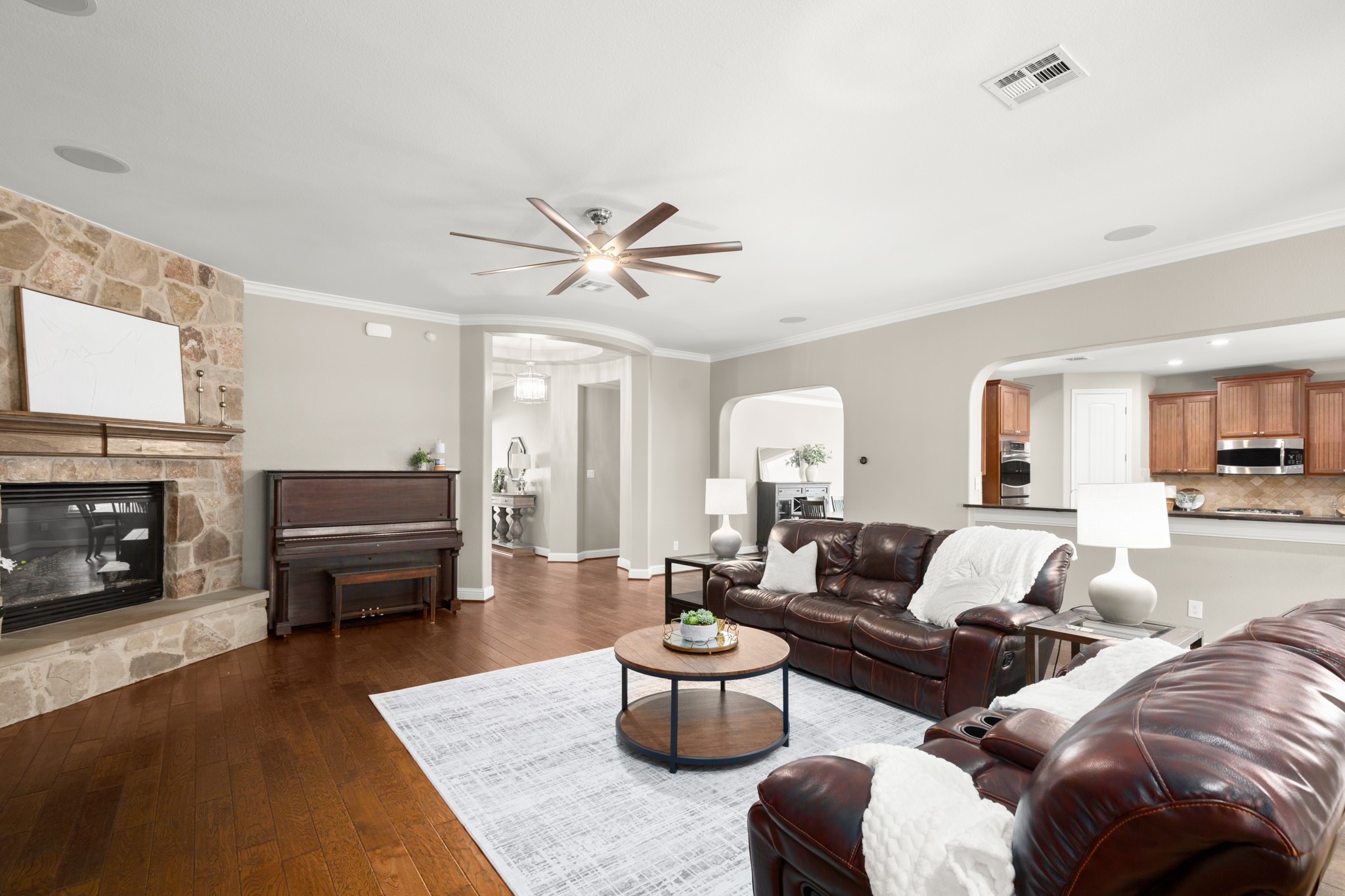 502 Spring Arbor Lane Cedar Park, TX 78613 - Photo 10 of 40 The living room opens seamlessly to the kitchen and formal dining room making it easy to stay connected.
