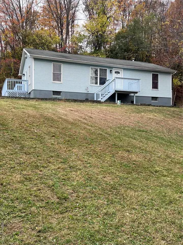 a house view with a backyard space