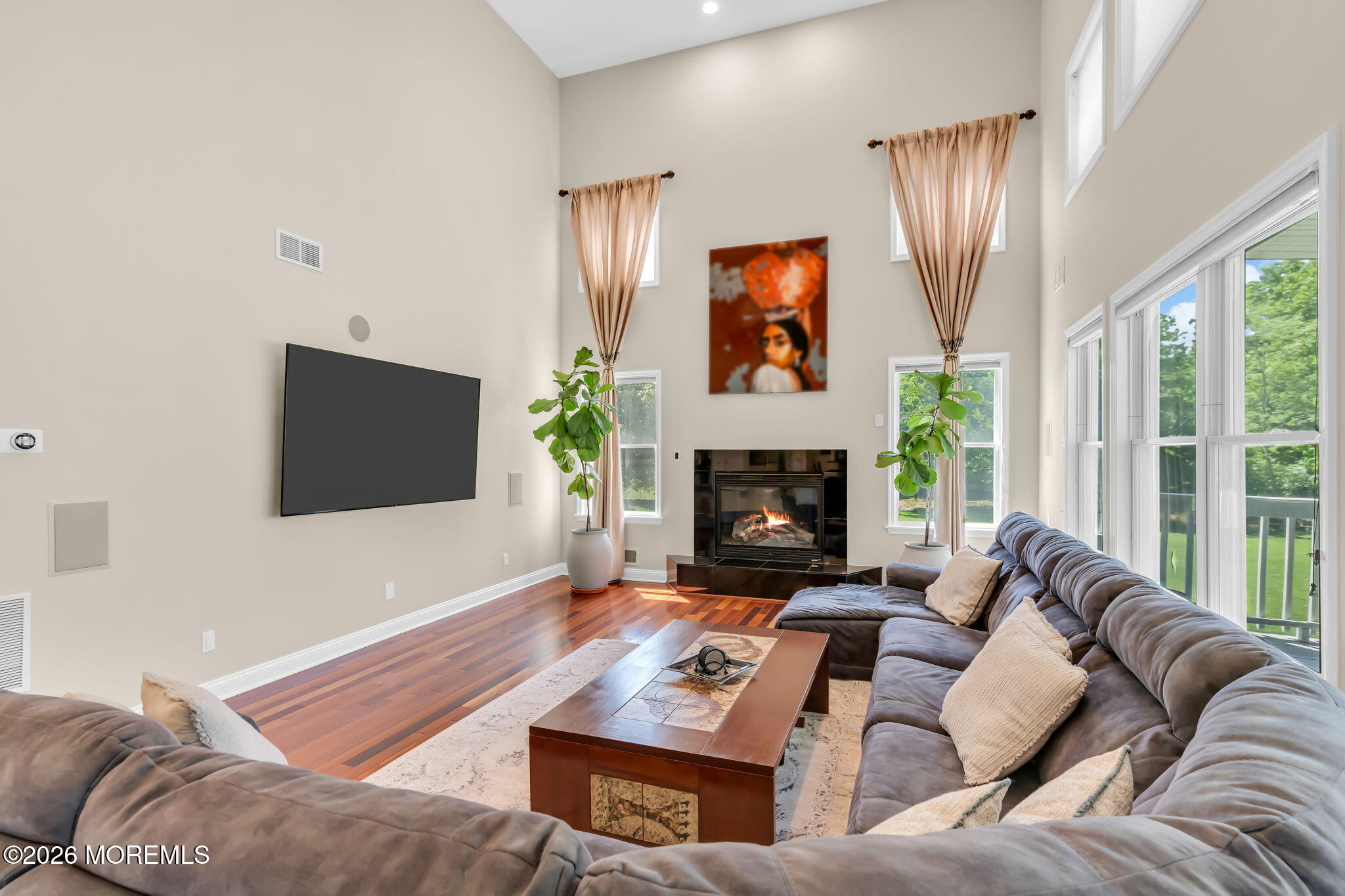 14 Diamond Hill Road Marlboro, NJ 07746 - Photo 28 of 79 a living room with furniture a large window and a fireplace