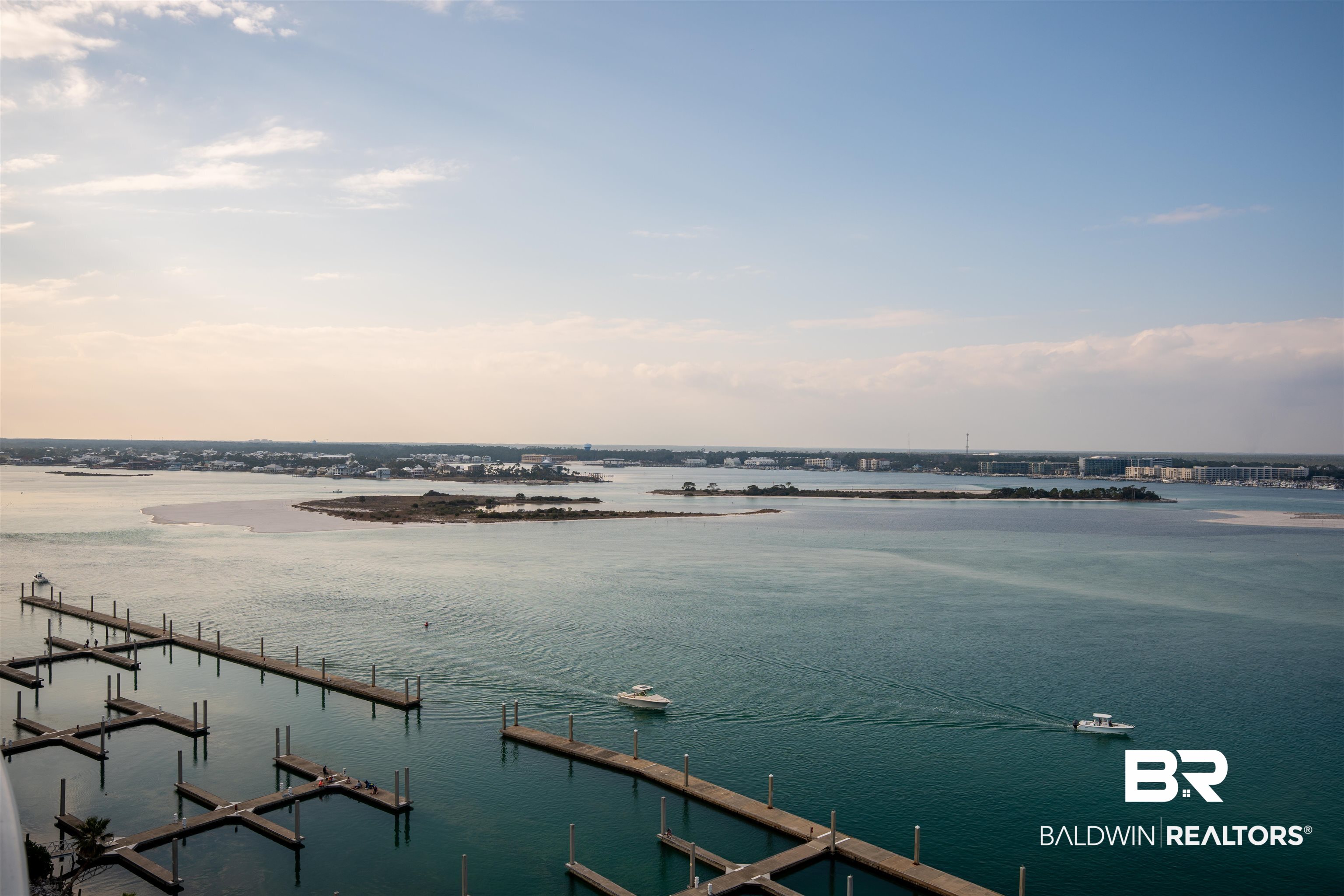 28107 Perdido Beach Boulevard, Unit DPH05 Orange Beach, AL 36561 - Photo 21 of 43 Water view featuring a boat dock