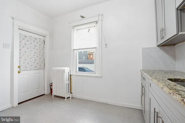 a view of kitchen and utility room