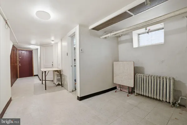 a bathroom with a granite countertop toilet a sink and a shower