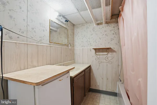 a view of a hallway with seating area