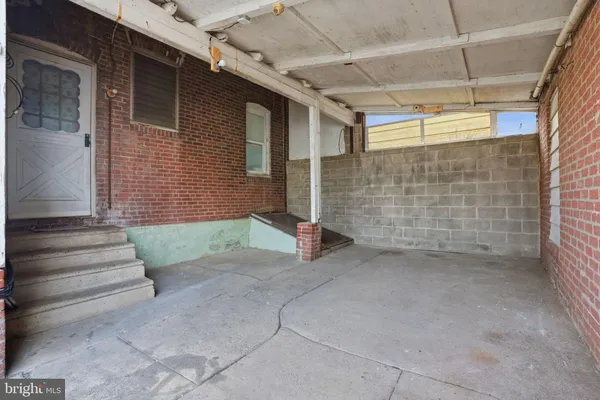 a view of a brick house with a outdoor space
