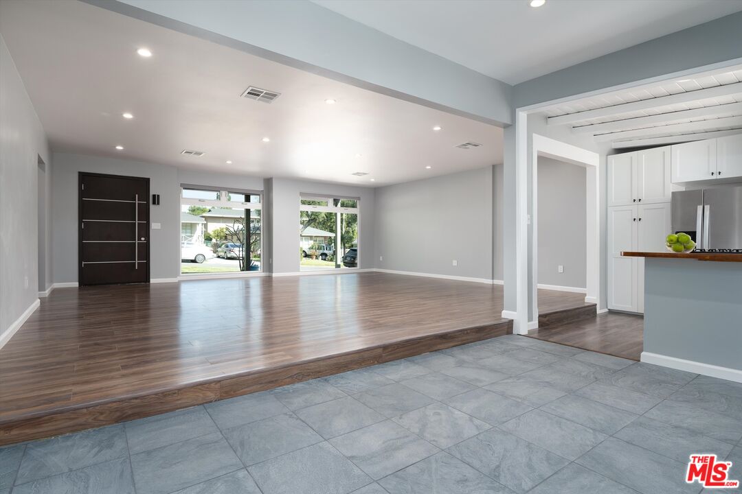 3061 Highview Avenue Altadena, CA 91001 - Photo 12 of 30 an empty room with wooden floor and windows