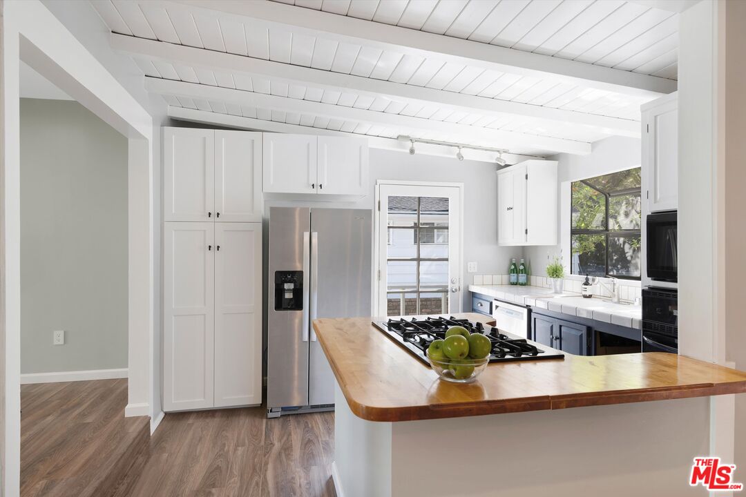 3061 Highview Avenue Altadena, CA 91001 - Photo 13 of 30 a living room with stainless steel appliances kitchen island granite countertop furniture and a wooden floor