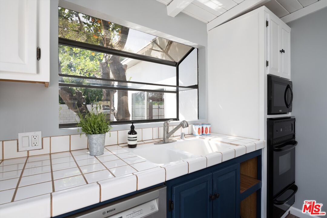 3061 Highview Avenue Altadena, CA 91001 - Photo 14 of 30 a kitchen with a sink and a window