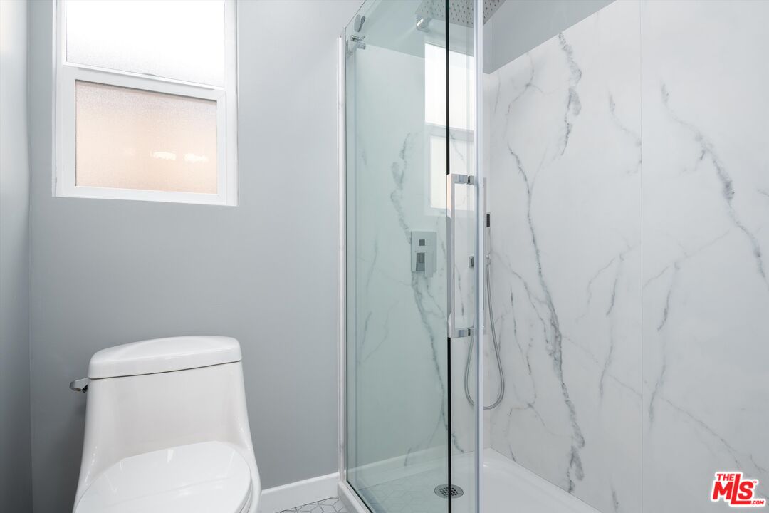 3061 Highview Avenue Altadena, CA 91001 - Photo 20 of 30 a white toilet sitting next to a shower